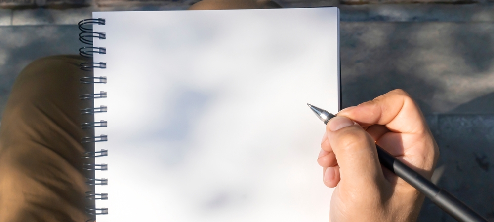 A,Man,Takes,Notes,,Sketches,Or,Makes,A,Plan,On